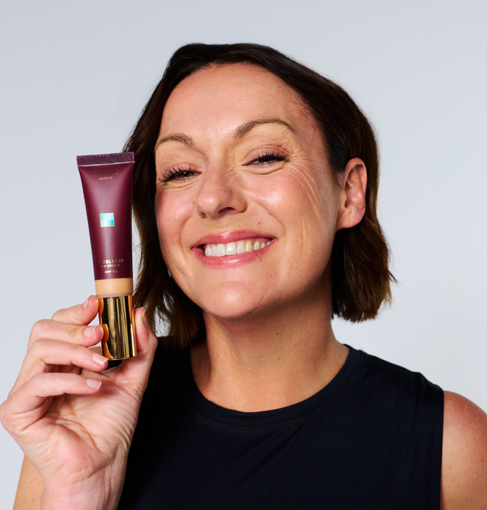 Celeste Barber holding BOOIE Excellent BB Cream SPF 30